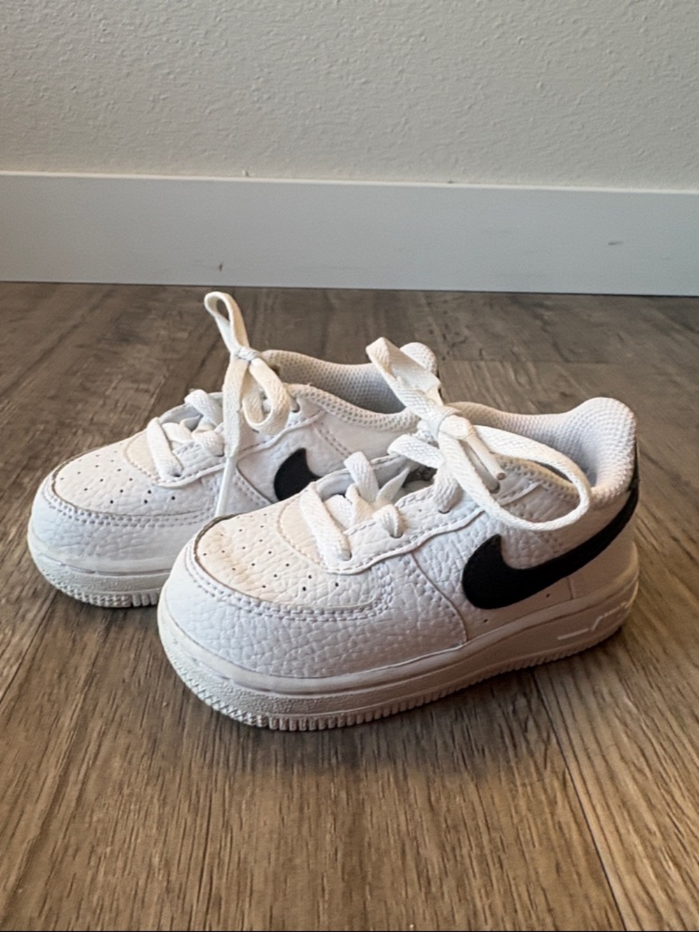 Nike Kids White Sneakers with Black Swoosh Accent